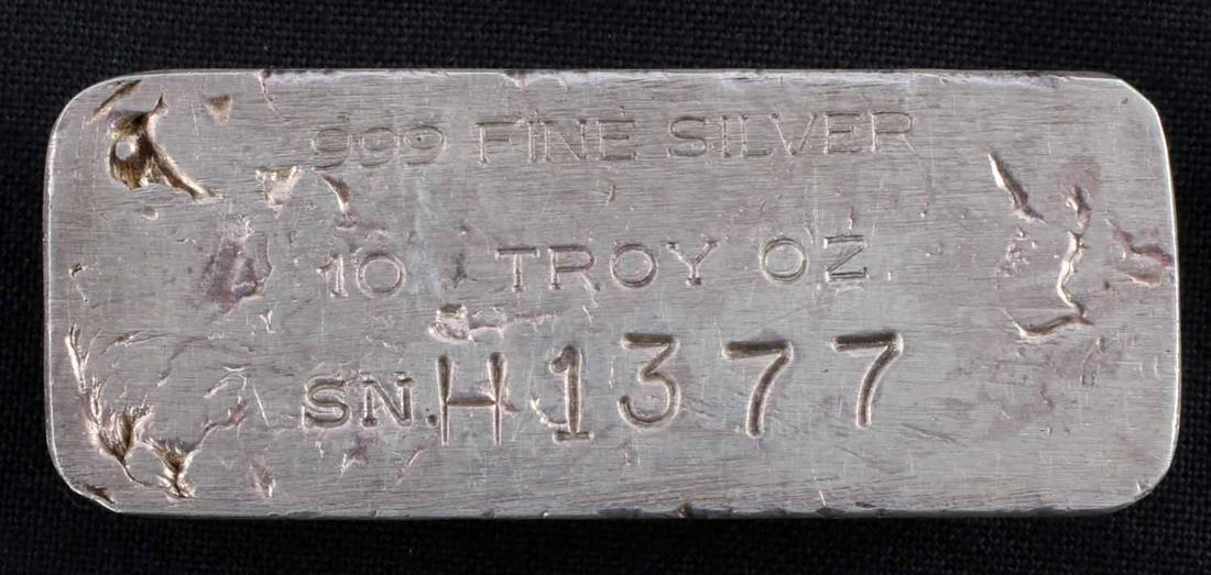 OLD POUR 10 OZ .999 SILVER LOAF BAR INGOT: Electronically tested for purity and spot on for weight, S/N H1377. This lot has a reserve.