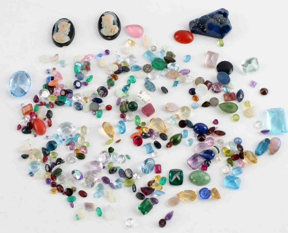 416 CARATS OF RECLAIMED COLORED GEMSTONES: Assorted gemstones and colored glass stones reclaimed from silver and gold rings, necklaces and earrings