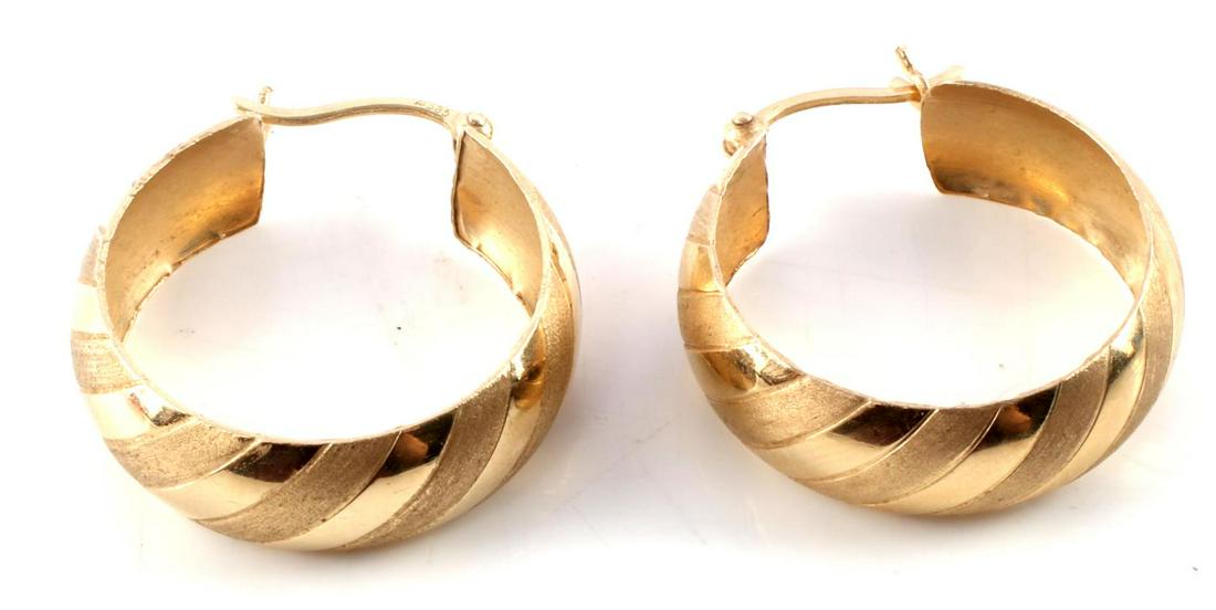 CANDY STRIPED 14KT GOLD HOOP EARRINGS: Hallmarked A in a circle 585 Candy Striped pattern of high polish and satin finish yellow gold. Dimensions: diameter 29mm, width 8mm. Total weight 4.2 grams This lot has a reserve.