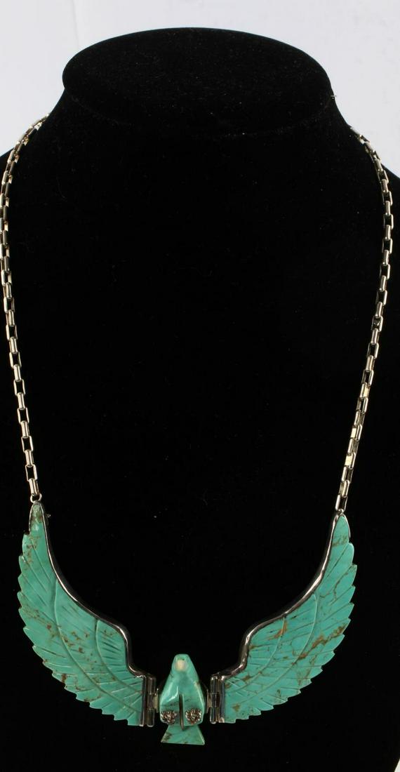 CALVIN DESSON NAVAJO STERLING EAGLE NECKLACE: Calvin Desson, Navajo silversmith, designed turquoise and sterling silver eagle gorget necklace with mother of pearl beak. Length of chain 17 inches, width of gorget 5 inches.