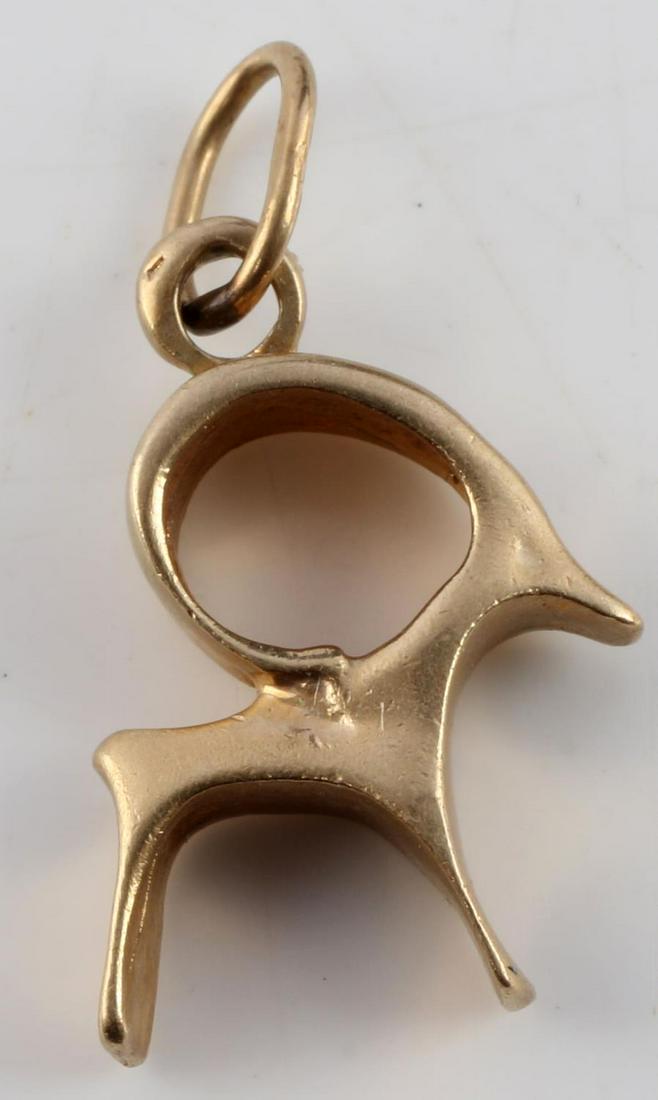 14K YELLOW GOLD RAM PENDANT ABSTRACT VINTAGE: Marked "14K' on bail and acid tested for purity. Total weight 2.6 grams and measures approximately .5 inch from top to bottom (without bail). In very good condition with very little signs of wear. Thi