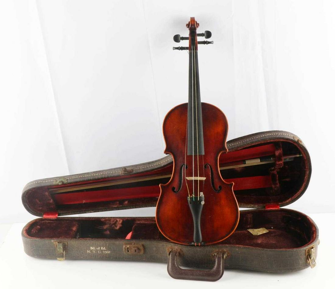 1968 VINTAGE GERMAN JOHN JUZEK VIOLIN WITH CASE: Maple body with ebony finger board, tuning pegs, and tailpiece. Measures 22 1/2 inches. John Juzek sticker marked in F hole. Comes with 27 inch Torte bow and case. Very good condition with some usage 