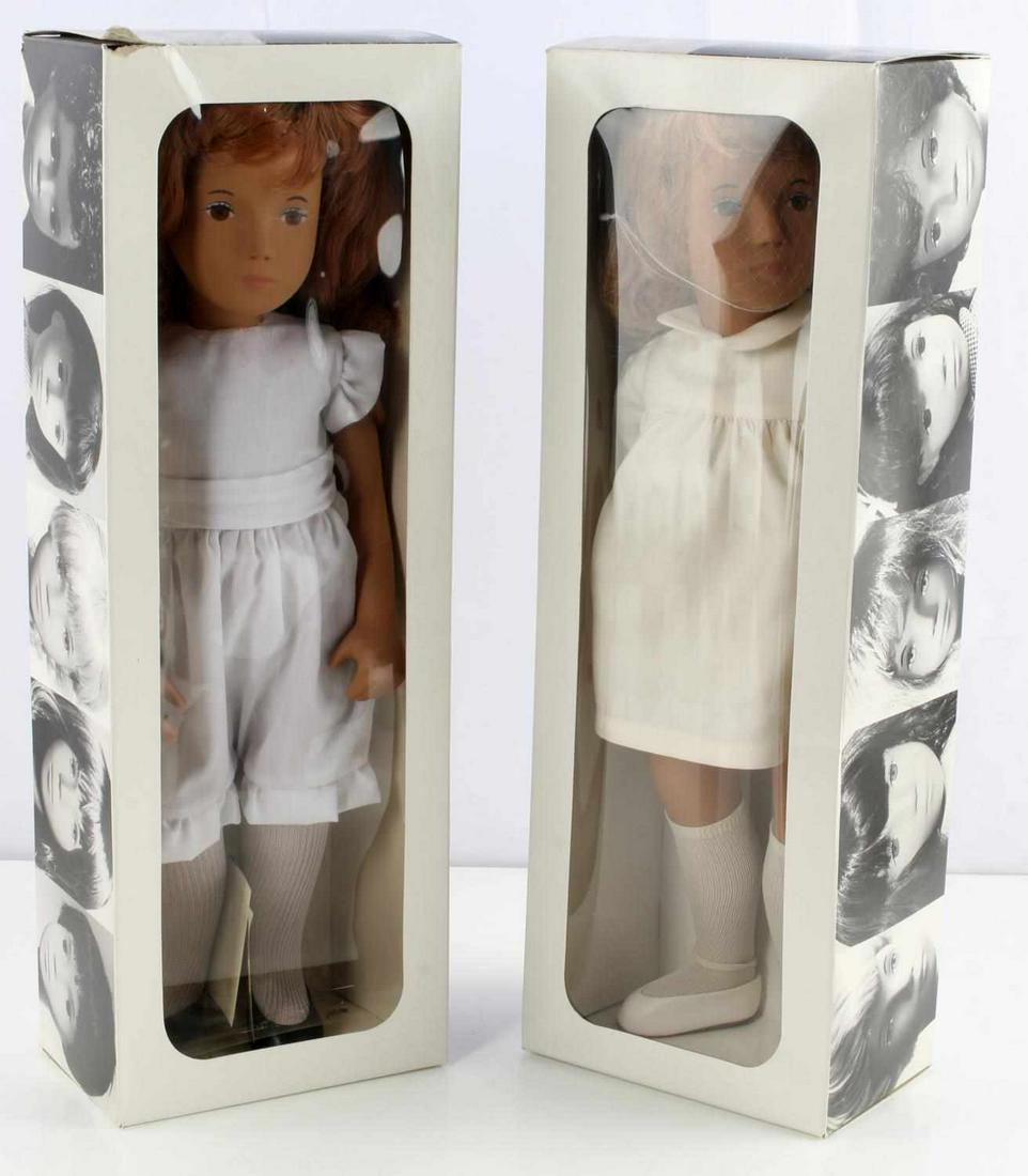 SASHA DOLL LOT OF 2 101 HONEY BLONDE 108 REDHEAD: Sasha dolls: 101 Honey Blonde with silk dress, and 108 Redhead. Made in England. Measure 16 inches long. Each comes in original box. Very good condition with little wear to box.