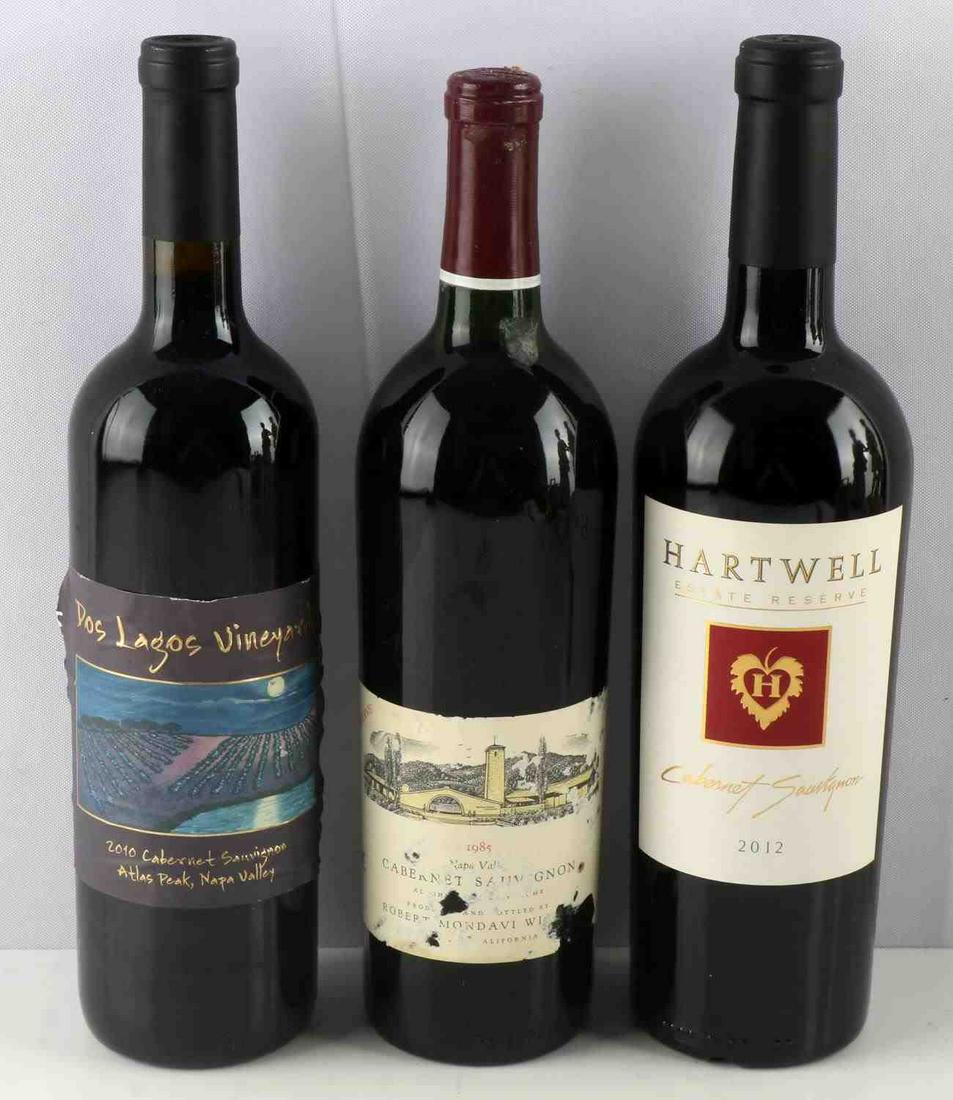 THREE BOTTLES OF CABERNET SAUVIGNON 1985 & 2000S: Three Bottles of Cabernet Sauvignon: 1985 Robert Mondavi Winery Reserve Cabernet Sauvignon. Top shoulder ullage, notes are floral with red currants, tobacco and cedar. 2012 Hartwell Vineyards Estate G