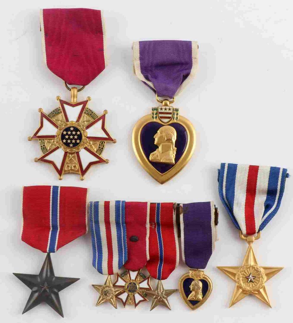 WWII SERVICE MEDALS BRONZE SILVER STAR MERIT HEART: Lot features full size and miniature set of service medals. Silver Star, Bronze Star, Legion of Merit, and Purple heart. Very good condition. No names. Measure 3/4 - 2 inches.