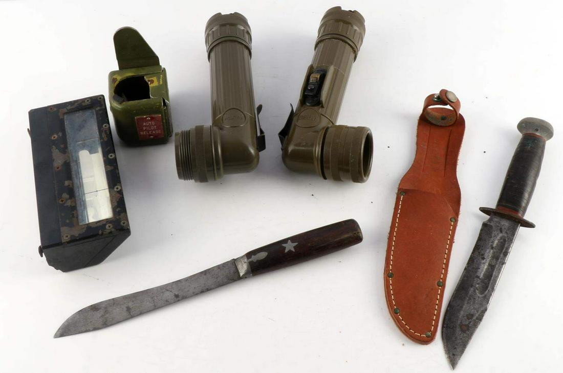 WWII TO VIETNAM GEAR FLASHLIGHT BOMBER AUTOPILOT: Lot features 2 Vietnam era flashlight model MX-99I\U, a tank periscope, a bomber autopilot release, a knife with no brand, and a RH PAL 36 fighting knife. Knives measure 10 1/2 inches. Autopilot butto