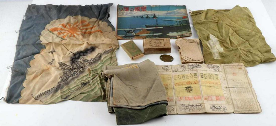 WWII IMPERIAL JAPANESE US VET BRING BACK FLAGS: Lot features small flags, dog tag, booklets, and cigarettes. Very good condition. Flags measure approximately 13 X 18 inches. Cigarettes are in fair condition and are in a quantity of 10. One booklet 