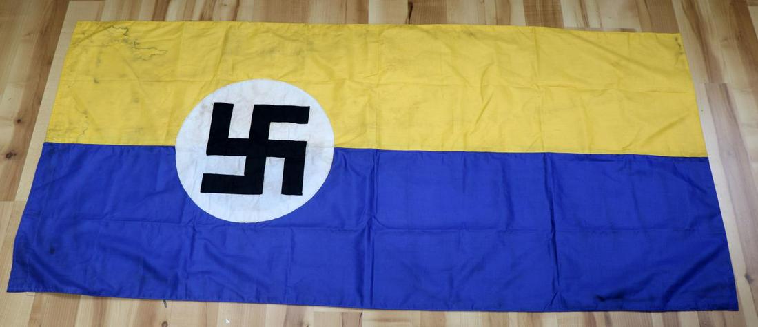 WWII GERMAN THIRD REICH LEIPZIG CITY BANNER FLAG: WWII German Reich Leipzig city banner flag measuring 58 1/2 inches long by 27 1/4 inches wide. City of Leipzig flag with its traditional coat of arms replaced by a swastika. Flag was likely hung on a 