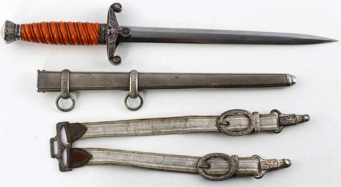 WWII GERMAN THIRD REICH HEER DAGGER AND SCABBARD: WWII German Third Reich Heer Dagger and Scabbard, measuring approx. 14.5 inches in total length with a 10 inch blade. Reverse of blade is makers marked Eickhorn, reads "Original Eickhorn Solingen." Bl