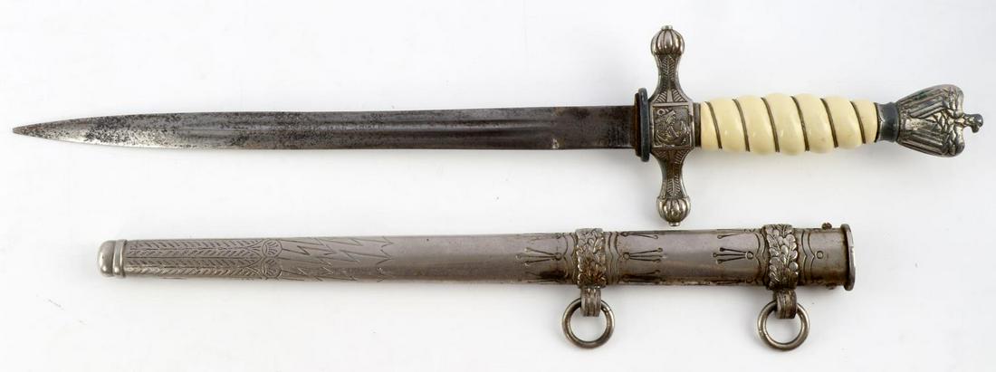 WWII GERMAN REICH KREIGSMARINE TYPE 2 DAGGER: WWII German Reich Kreigsmarine type 2 dagger and scabbard in good condition. Blade has significant pitting intermittent throughout. Pitting and some finish loss on crossguard, and pommel. Grip in good