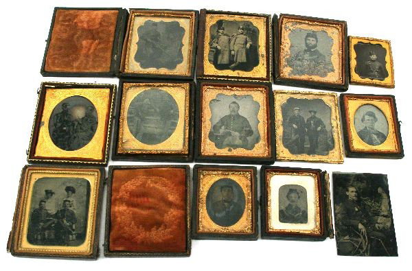 COLLECTION OF 13 CIVIL WAR TINTYPE SOLDIER PHOTOS: Collection of 13 small individually framed tintype photos of various Civil War soldiers. Some are pictured with their weapon, others with their brothers or wives. All are contained in a padded glass c