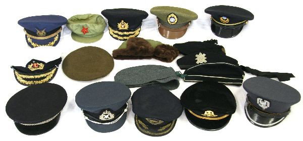 GROUPING OF 17 VARIOUS WORLD MILITARY HATS: 17 various military hats and caps from around the world. Places include Scotland, Taiwan, Slovakia, China, Spain, and more. All are in good to very good condition.