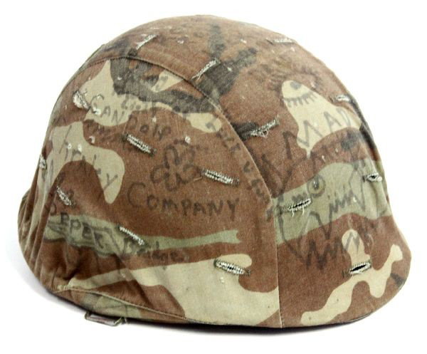 VIETNAM M-1 HELMET WITH 1960'S GRAFITTI: A Vietnam M-1 helmet belonging to a Seabee , liner and helmet camouflage cover is covered in period Vietnam grafitti