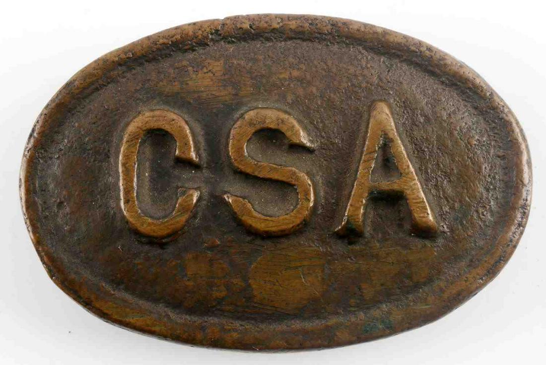CONFEDERATE STATES ARMY CIVIL WAR CSA BELT BUCKLE: Confederate States Army Civil War CSA Enlisted Mans Belt Buckle. Measures 3 inches wide by 2 inches tall. The front reads "CSA" in relieved letters in the center of the oval belt buckle. Has two flat 