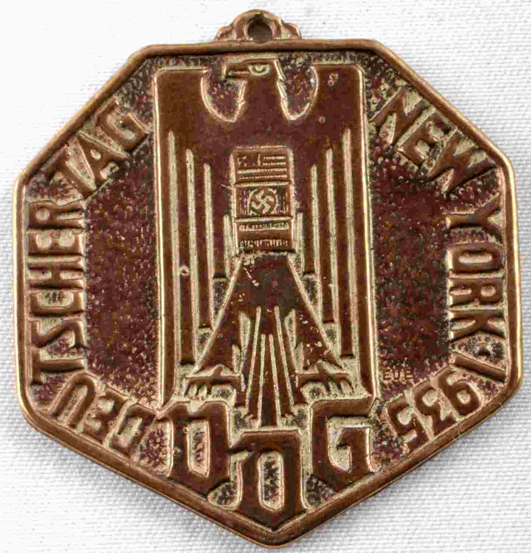 WWII GERMAN THIRD REICH AMERICAN BUND DOG TAG NY: WWII German Third Reich American Bund 1935 Deutscher Tag New York VDG Medal. Decoration, measures approx. 1.75 X 1.5 inches. The front shows a German World War II eagle with a swastika in the center o