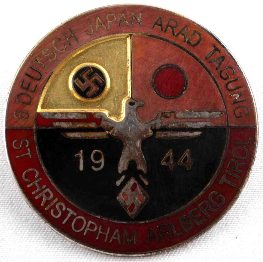 WWII GERMAN JAPANESE EMPIRE 1942 ALLIANCE BADGE: WWII Japanese 1944 Alliance Badge, measures approx. 1.5 inches in diameter. The front reads "6 Deutsch Japan Arad Tagung St Christopham Arlberg Tirol 1944." Has a German eagle clutching a swastika in 