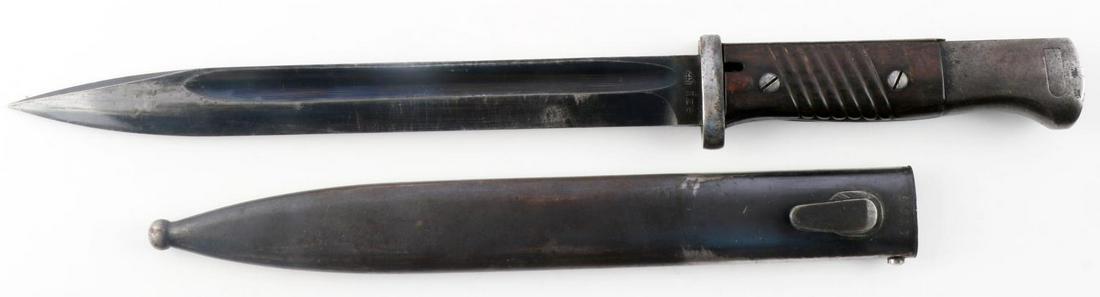 WWII GERMAN THIRD REICH MAUSER K98 COMBAT BAYONET: WWII German Third Reich Mauser K-098 Combat Rifle Bayonet & Scabbard. The blued steel blade measures approx. 1 X 9.77 inches. The blued steel scabbard measures approx. 1.25 X 10.75 inches. Has a pair 