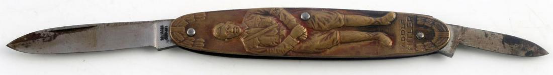WWII GERMAN THIRD REICH AH ELECTIONS POCKET KNIFE: WWII German Third Reich Dictator Adolf Hitler Pocket Knife, measures approx. 6.5 inches long with both blades open. The longer blade is marked "Solingen." The side of one of the handles shows a full b