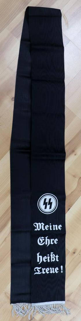WWII GERMAN THIRD REICH HIGH COMMAND FUNERAL SASH: German WWII Waffen SS High Command Casket Funeral Sash. Measures 4.75 inches wide by 84.25 inches long. The front side reads “SS Meine Ehre heist Treue!,” (My Honor is Loyalty!). Inverse reads “