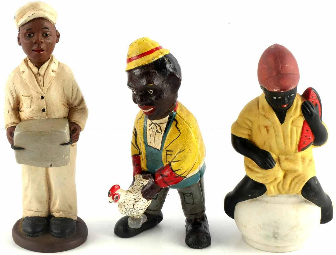 BLACK AMERICANA FIGURINE LOT IRON BANK & WOODEN: 3 figurines: child with watermelon porcelain bank, milk man wooden figure (marked JP), and man with chicken cast iron bank. Measure 6 inches and under.