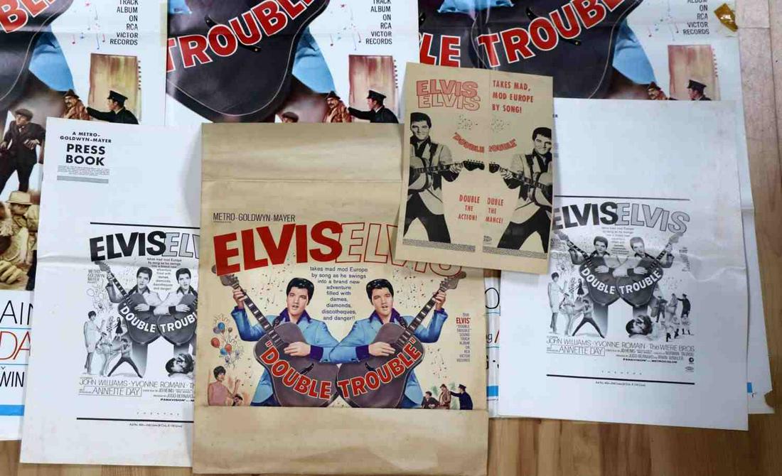LARGE LOT ELVIS DOUBLE TROUBLE THEATRICAL PROMOS: Large lot of vintage "DOUBLE TROUBLE" theatrical promo/marketing material includes: three (3) original 27X41 inch1966 theatrical one-sheet movie posters (all the same), two (2) rare MGM press books (s