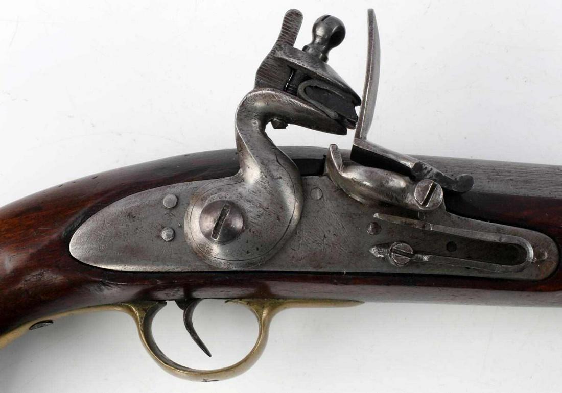 BRITISH TOWER TYPE FLINTLOCK PISTOL .78 CALIBER: Unmarked flintlock pistol with a 9 1/8 inch barrel, bore measures 20 mm across and is clear, ramrod present, brass guard is marked 45 to exterior. Entire length is 16 inches. Very good condition. No i