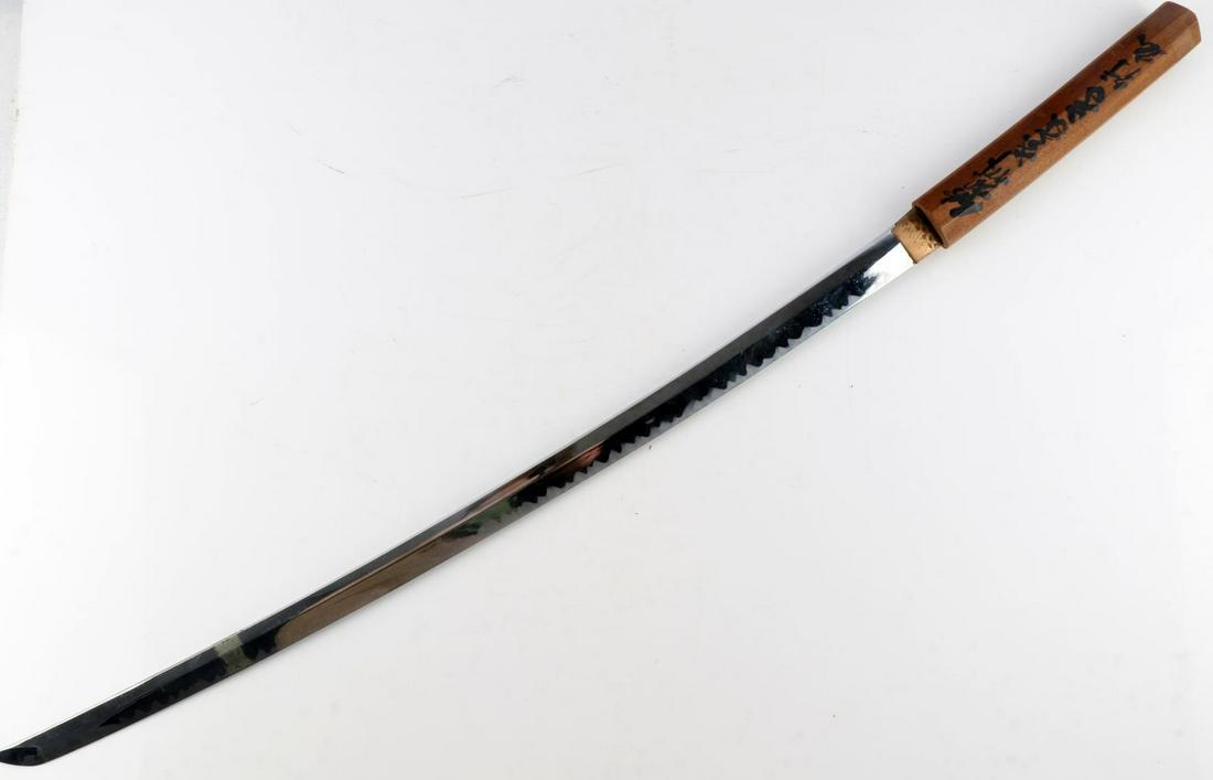 MODERN JAPANESE KATANA DISPLAY WITH WOODEN HILT: Japanese katana. No edge. Wooden hilt with Kanji writing. Measures 38 3/4 inches. Very good condition. Hilt is loose.