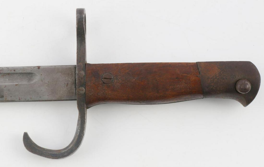 WWII IMPERIAL JAPANESE TYPE 30 BAYONET W SCABBARD: Type 30 Japanese bayonet with scabbard. Scabbard numbered 81713. Bayonet edge has been filed to a blunt edge. Measures 20 3/4 inches. Minor oxidation but very good condition.