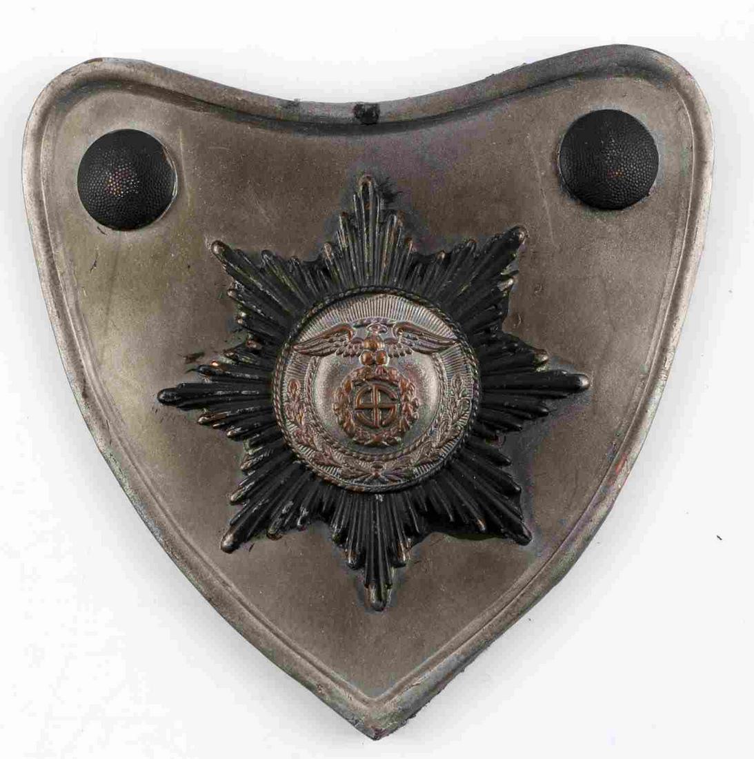 WWII GERMAN THIRD REICH SA BEARERS GORGET: Third Reich SA gorget. Features eagle clutching swastika atop starburst pattern. 2 button rivets on either side. Green felt back with 2 prongs. Measures 5 1/2 inches. Unauthenticated, sold as is.