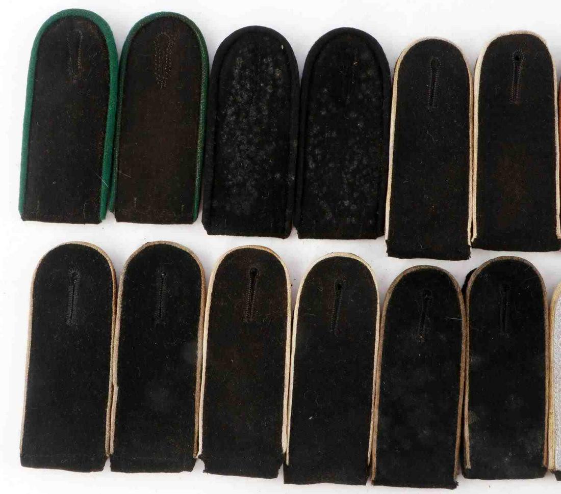 10 PAIRS OF WWII GERMAN SS RANK SHOULDER BOARDS: Featured are panzer, engineer, military police, mountain troops, and more. Measure 4 1/4 inches. Very good condition with minor wear. Some fluoresce. Unauthenticated, sold as is.