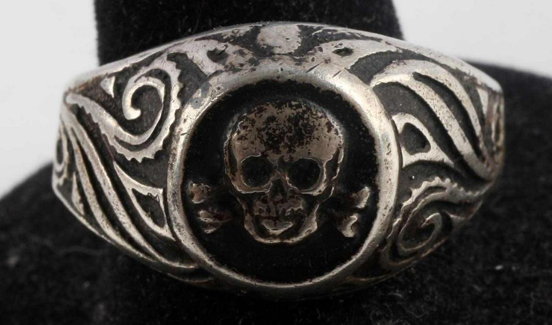 WWII GERMAN THIRD REICH SS SKULL SILVER RING SZ 11: WWII German Third Reich SS Skull Silver Ring; size 11, marked "835" on interior shank for silver content, acid tests as silver, weighs 7.3 grams. Design displays SS Skull with symmetrical designs on e
