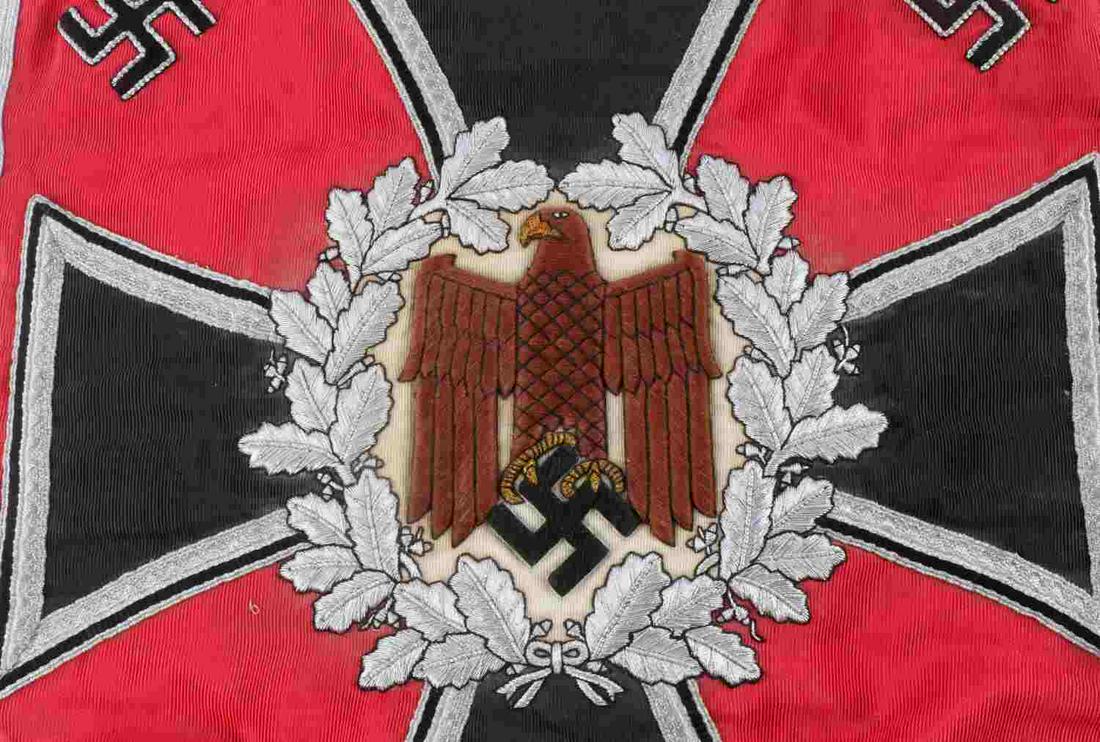 WWII THIRD REICH GERMAN ARTILLERY TRUMPET BANNER: Red background with black Iron Cross and brown eagle at center, silver bullion and black border, silver bullion fringe, leather straps for hanging. Square measures 13.75 X 12.75 inches. Outer border d
