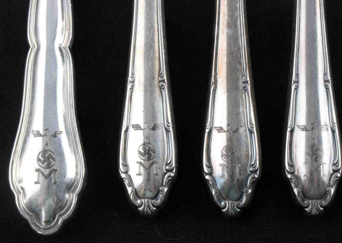 8 WWII GERMAN THIRD REICH KRIEGSMARINE FLATWARE: 4 spoons and 4 knives. Rostfrei and Wellner marked. Some have a flotilla and monogrammed with an M. Measure 7 inches. Very good condition. Unauthenticated, sold as is.