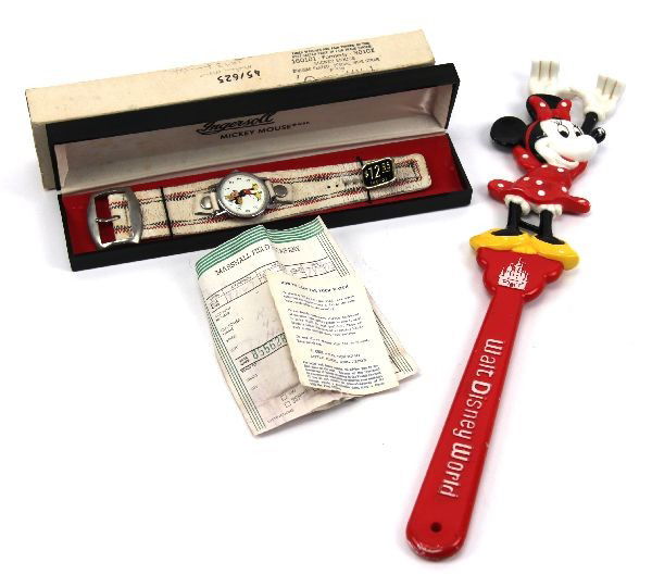 VINTAGE DISNEY INGERSOLL MICKEY WATCH & SCRATCHER: 1970's Ingersoll Mickey Mouse chrome plated watch with leather band in original box with receipt and a vintage Minnie Mouse back scratcher. Overall good condition with wear to leather watch band and p