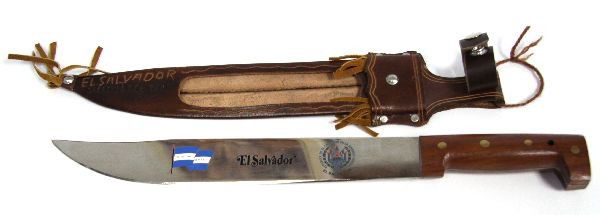 EL SALVADOR COMMEMORATIVE MACHETE: El Salvador commemorative machete knife. 12 inch blade, embossed with the flag and seal of El Salvador. Decorative leather scabbard.