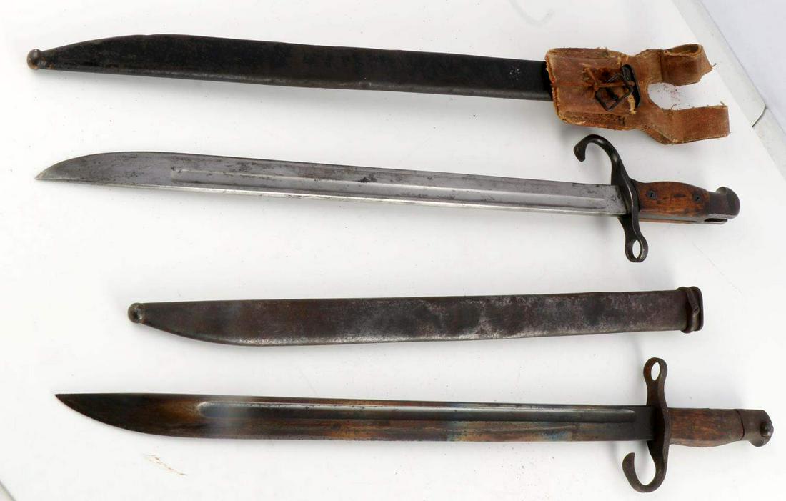 WWII IMPERIAL JAPANESE ARMY BAYONET LOT OF 2: Includes one with hard cloth frog, and very good blade, some denting to scabbard, the second an early war, curved quillon, good blade some denting to scabbard.
