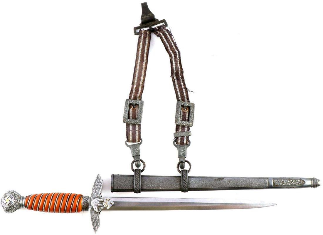 WWII GERMAN REICH 2ND MODEL LUFTWAFFE DAGGER: nd model Luftwaffe dagger. Steel blade. Aluminum Reichsadler crossguard, aluminum pommel, and bakelite grip. Housed in pebbled scabbard with Luftwaffe hangers. Blade Eickhorn marked. Hangers marked DR