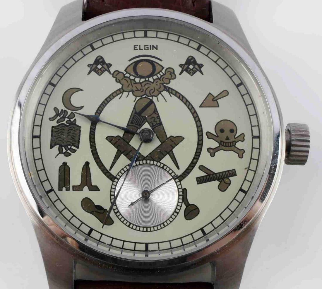 ELGIN 7 JEWEL GRADE 301 MASONIC WRIST WATCH: Elgin 7 jewel Masonic wrist watch. Mechanical movement. Starts and holds time. 12s size. Nickel movement finish. Serial number 19441105. Very good condition. Case measures 50mm. This lot has a reserve