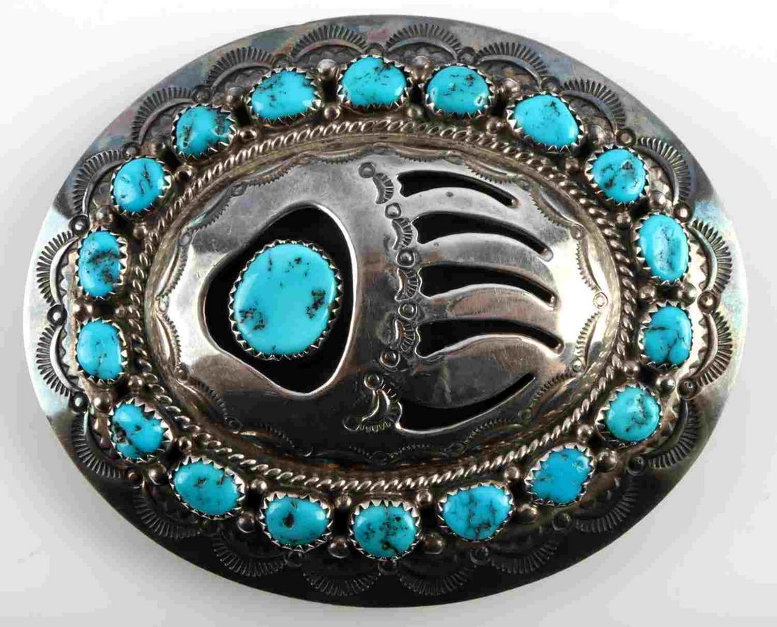 MUSKET NAVAJO STERLING SHADOW BOX BELT BUCKET: Hallmarked W.M. for Wilbur Musket Navaho silversmith. buckle features Sleeping Beauty turquoise and a bear claw shadow box design. Total weight 55.8 grams. Dimensions: approx 3x2 3/4 inches, fits a 1