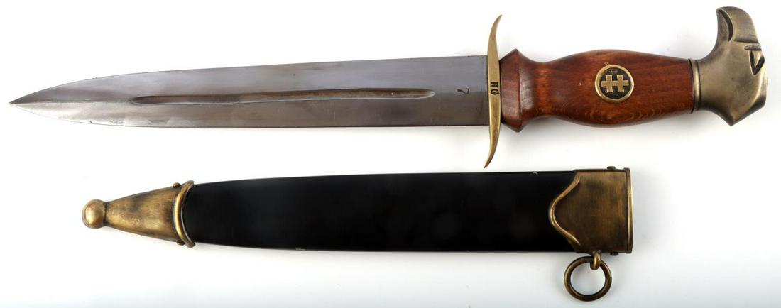 WWII SLOVAK HLINKA GUARD M39 DAGGER NUMBER 7: WWII Slovakian Hlinka guardsman dagger Steel blade with wooden grip, brass crossguard and pommel. Magnetic scabbard also with brass throat and chape. Crossguard marked HG and blade marked 7. Measures