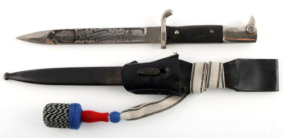 WWII GERMAN REICH ENGRAVED WALKING OUT BAYONET: WWII German Reich walking out bayonet engraved on pommel with a totenkopf symbol below a tank, engraved on blade "Zur Erinnerung an meine Dienstzeit". Engraving on blade is off-centered, and has some