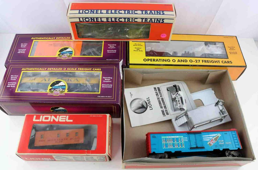 LIONEL MTH RAIL KING O GAUGE TRAIN CARS: All new in box and include Lionel Automatic Cola car 6-16777. Lionel Illuminated Caboose 6-9169, Bunk Car 6-5726, MTH Alaska Hopper car, MTH Alaska Tank car, Rail King searchlight car.