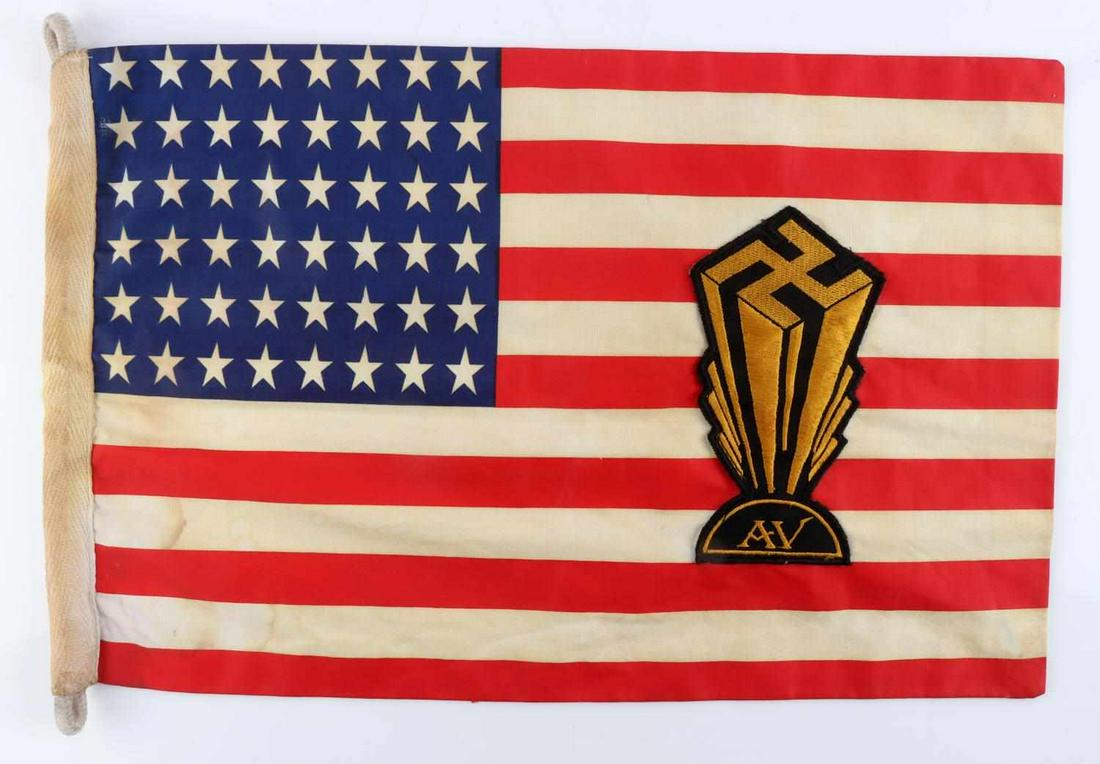 WWII GERMAN AMERICAN BUND NAZI PARTY PARADE FLAG: Waxed cotton American flag with American Nazi insignia. Measures 16 X 10 inches. Very good condition with light staining. This lot has a reserve.