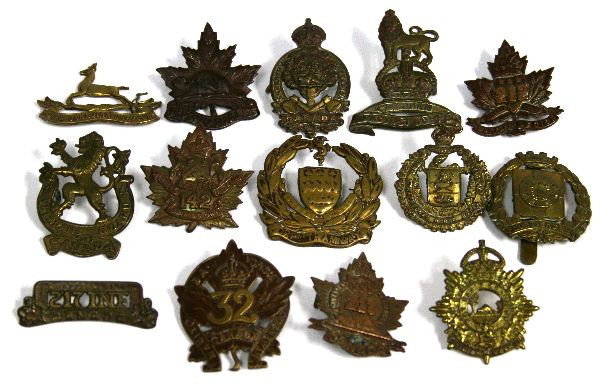 WWI CANADA ORIGINAL CAP BADGE LOT OF 12: A grouping of 12 WWI Canadian Cap Badges some quite scarce all original as follows: Veterans Guard, Frontiersmen, slider intact; Oxford Rifles, lugs intact; Royal Canadian Dragoons, without lugs; The 