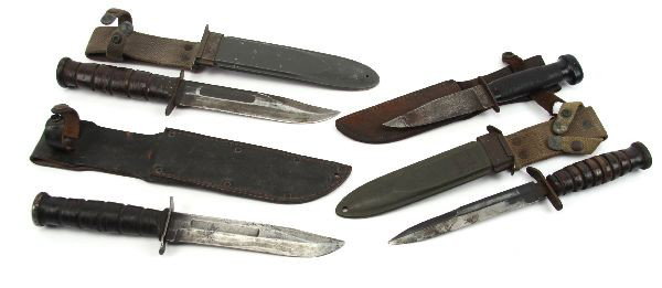 GROUPING OF FOUR WWII US FIGHTING KNIVES: Grouping of four US WWII fighting knives. A Mark 2 fighting knife, with scabbard; USN ground down Mark 1; a mark 3 Camillus, with part of grip missing; a USN Mark 2 in good condition. First three vary