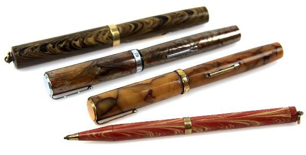 WATERMAN YELLOW RIPPLE 52V FOUNTAIN PEN LOT: Grouping of three Vintage Waterman fountain pens and one mechanical pencil. An Ideal Yellow Ripple 52V with gold filled trim and lever (bladder missing), an Ideal Patricia gold marbled design with lev