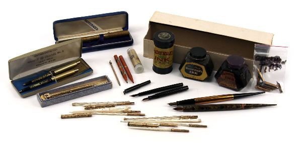 VINTAGE PEN LOT- WATERMAN CHANNEL & OTHERS: Grouping includes: Arpege Channel No. 5, 14K gold filigree perfumed writing pen set, (2) Waterman desk fountain pens with levers, an Ideal Yellow Ripple, an Ideal with gold filled band (both missing b