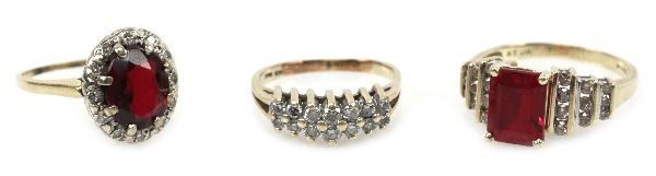 LADIES YELLOW GOLD RUBY & DIAMOND RING LOT OF 3: Size 5.5 10K gold ring with (14) round full cut diamonds ranging from approx. 0.03 to 0.06ct. Size 8 14K gold ring with an approx. 2.6ct emerald cut ruby and (18)channel set round full cut diamonds ra