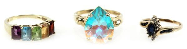 LADIES 14K YELLOW GOLD MIXED GEMSTONE RING LOT: Size 5 ring with an approx. 0.32ct sapphire center stone. Size 6.25 ring with emerald cut amethyst, aquamarine, garnet, citrine and peridot stones, each measuring 6x4mm. Size 8.25 ring with an approx.