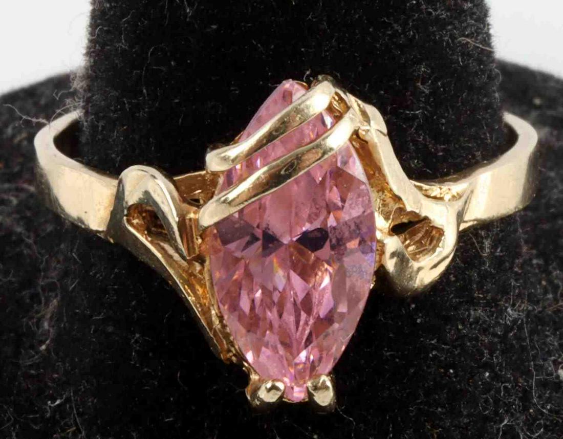 1.83 CT PINK SPINEL 10K YELLOW GOLD MARQUIS RING: Ornate setting and stamped "10K" inside shank. Size 9, in very good condition. Total weight 3.3 grams. Stone is sound in its setting. This lot has a reserve.